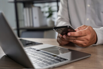 Naklejka na ściany i meble man checking new email notification on phone in workplace Communication networking or social media. Agenda, app and schedule with man checking calendar Naklejka na ściany i meble man checking new email notification on phone in workplace Communication networking or social media. Agenda, app and schedule with man checking calendar