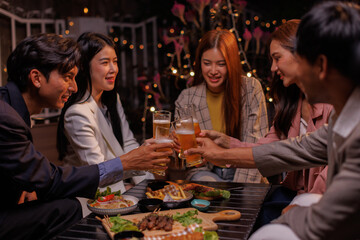 Happy Group of people Asian friends Drinking beer outdoors at the brewery for the New Year festival night time
people
