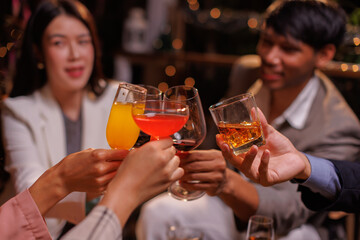 Group of people Throw a party Celebrate whiskey at a friendly party in a restaurant. Night.
