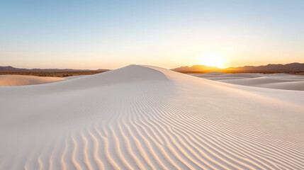 Soft pastel dawn over sand dunes creates peaceful, minimal mood