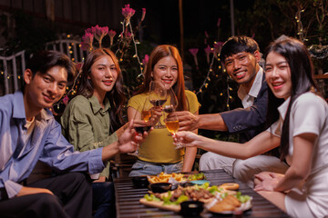 Glasses of Happy friends rose wine seen during a friendly party of a celebration.
