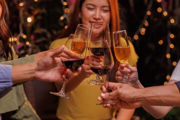 Glasses of Happy friends rose wine seen during a friendly party of a celebration.
