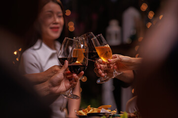 Group of people toasting with champagne glasses at a celebration. Hands holding champagne, clinking glasses. Festive atmosphere, joyful celebration, champagne toast. People toasting with champagne.
