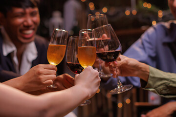 Group of people toasting with champagne glasses at a celebration. Hands holding champagne, clinking glasses. Festive atmosphere, joyful celebration, champagne toast. People toasting with champagne.
