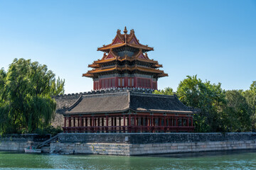 Fototapeta premium The magnificent ancient Chinese palace corner tower by the water