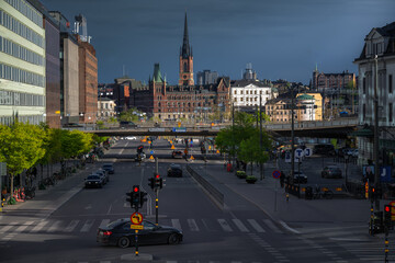 Busy Stockholm avenue  filled with city life and architecture.