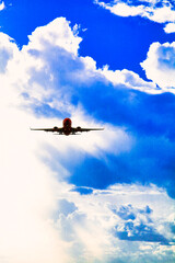 雲の中を飛ぶ飛行機合成