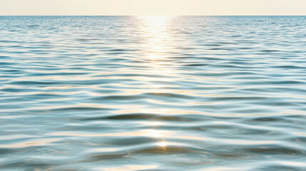 Obraz premium Soft sunset reflection on ocean surface creates serene atmosphere with warm pastel tones