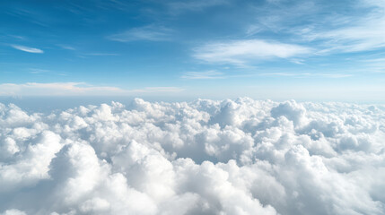 Soft white clouds under pale blue sky create serene atmosphere, evoking tranquility and peace
