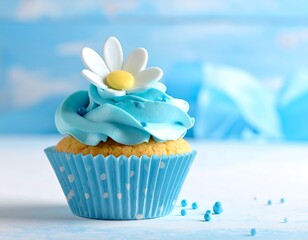Close-up of a single, adorned cupcake with blue frosting and a flower