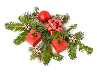 Christmas tree branches with ball, gift boxes, decorative snowflakes and cones on white background