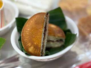 A plate of food with a banana split in the middle