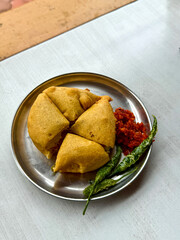 A plate of food with four small pastries on it