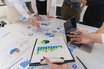 Business meeting using hands and equipment and writing, with emphasis on collaboration. Business executives analyzing documents, data and calculating about tax fees at office. Close up.