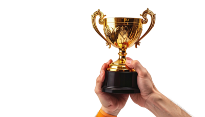 Hands holding golden trophy. Black background. Success.