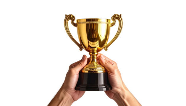 Trophy held up against black. Hands grip cup