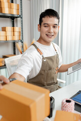 Ecommerce startup with young business owner, managing packages and sales, highlighting teamwork,...