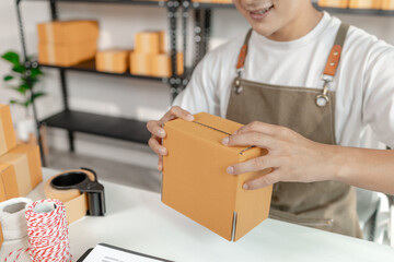 Small business entrepreneur in ecommerce startup, showcasing online retail, packaging process,...
