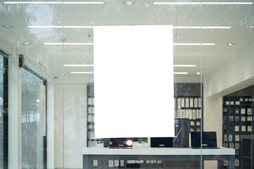 Blank white poster on glass wall inside modern store for advertising mockup or business marketing...