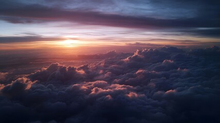 Breathtaking aerial view of sunrise over a vast cloudscape painted with warm hues of orange and pink