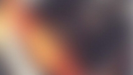 Abstract blurry background with warm tones and dark hues