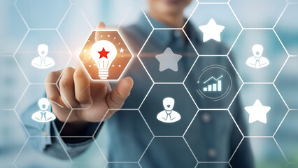 Business Innovation Concept With Digital Hex Grid And Lightbulb Idea Icon In Front Of A Team

