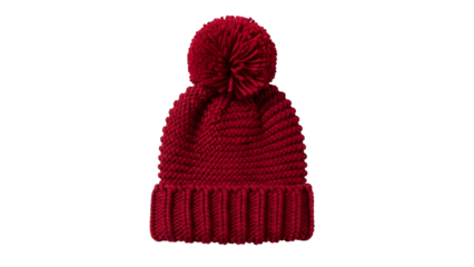 Knitted red winter hat with a pompom centered against a black background