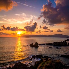 Ocean scene Sun setting over the horizon, rocky coastline below