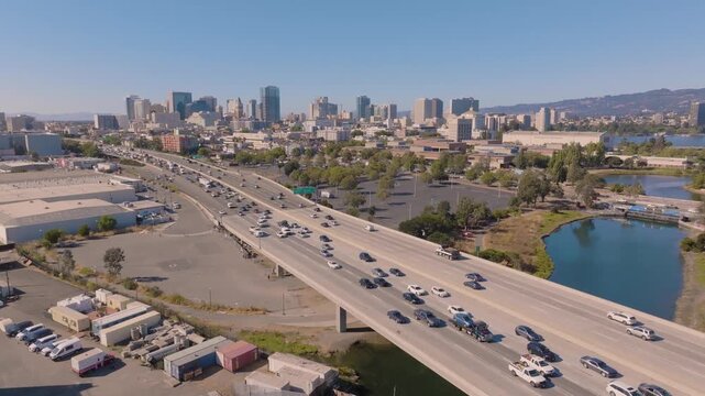 4K aerial drone footage of Interstate 880 in Oakland, California, showing dense car traffic moving slowly during peak commute hours.