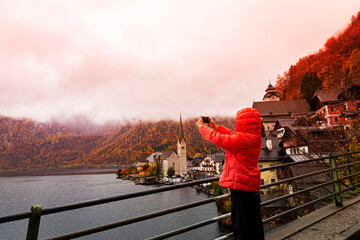 Tourist Photographing the Autumn View of Hallstatt