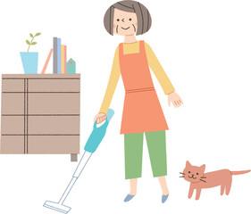 リビングの掃除をするシニア女性