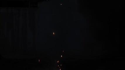 A spectacular, traditional Diwali ground firework ('Anar') erupting in a brilliant, vertical stream of golden sparks against a dark night, capturing the excitement of the Festival of Lights. - Powered by Adobe