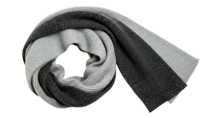 Knitted winter accessory with alternating light and dark gray sections is neatly coiled on a black background