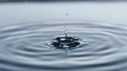Close-up of water ripples expanding in slow motion after a single drop, creating perfect circular lines on the surface condensation, reflection, zen - Powered by Adobe