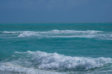 Ocean waves. Stormy sea waves. Summer sea beach wave. Foamy ocean waves. Summer ocean breeze. Dreamy summer beach background. Ocean splash waves.