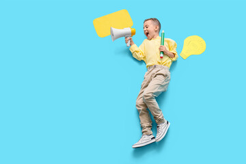 Cute little schoolboy with large pencil, megaphone and blank speech cloud on blue background