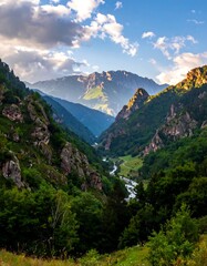 Naklejka premium A dramatic view of a mountain valley with river, forest, and sky