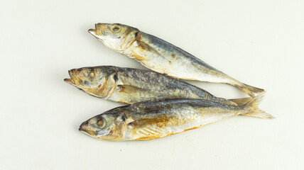 Dried salted fishes on white background
