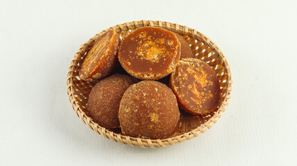 Organic brown sugar or coconut sugar or palm sugar on white background

