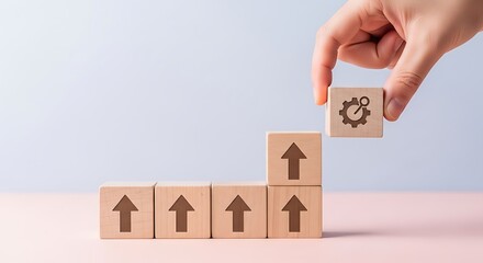 Wooden blocks ascending with a gear icon signaling progress and innovation in business growth