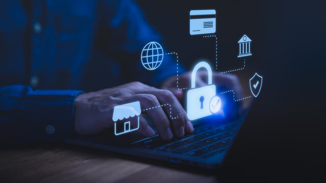 Person using a laptop computer with glowing lock and fintech icons, symbolizing cybersecurity, online banking protection, secure payment, data privacy, financial safety, and internet security concept.