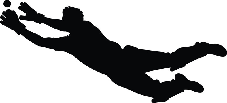 Silhouette of a soccer goalkeeper diving to make a save