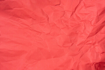 Red recycled paper texture as background, Red crumpled paper texture, Rectangular crumpled red paper sheet.