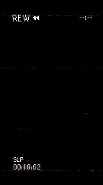Vertical VHS video tape rew rewind with screen distortion noise on black background. 4K Video