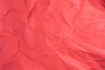 Red recycled paper texture as background, Red crumpled paper texture, Rectangular crumpled red paper sheet.