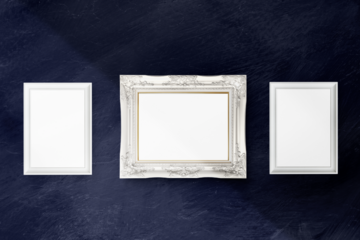 White picture frame mockup hanging on a blue wall