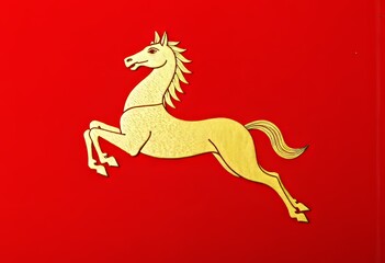 Obraz premium Golden Horse Illustration Leaping Against Bold Bright Red Background Symbolizing Energy and Movement
