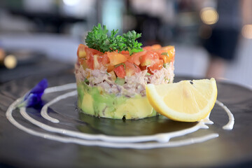 breakfast in the restaurant, table setting with fresh salad with fish, a delicate background of food on a plate