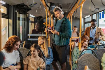 Diverse passengers commuting using public transport bus