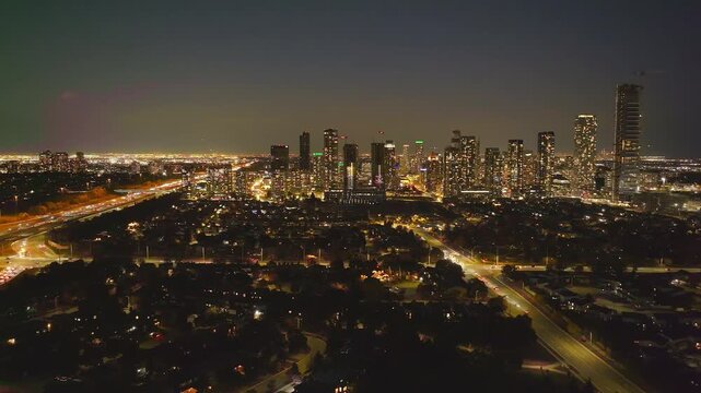 Cityscape view of Mississauga condos and HWY 403 at night